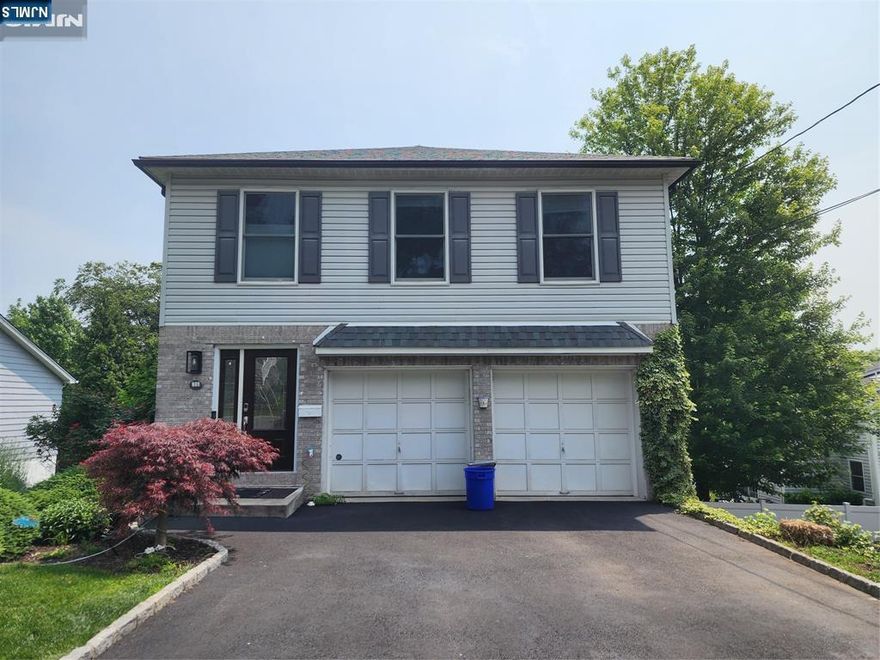 Bright & Spacious 5-Bedroom Colonial Move right into this sun-filled Colonial built in 1994, offering 5 bedrooms, 2 full and 2 half baths, and a great layout for family living. Features include a welcoming foyer, living and dining rooms, eat-in kitchen with sliders to the deck, powder room, and 2-car attached garage. Upstairs offers a primary suite plus 3 bedrooms and a full bath. The lower level includes a family room, 5th bedroom, and half bath. with exit to back yard . Hardwood floors throughout. Hardwood floors throughout. Beautiful hardwood floors run throughout the home, adding warmth and elegance. Don't miss this opportunity to a bright, spacious Colonial in a desirable location.