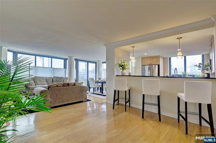 Donâ€™t miss this spacious and sun-filled two-bedroom, two-bath corner home at 700 Grove, one of Jersey Cityâ€™s most desirable addresses. This expansive 1,395 sq ft residence offers an open-concept layout with a generous living and dining area, a large private corner balcony ideal for relaxing or entertaining, beautiful hardwood floors, and tasteful modern finishes throughout. Enjoy the convenience of garage parking for one car along with exceptional amenities, including a 24-hour concierge, stylish lobby, shuttle service to the Hoboken PATH, NJ Transit and NY Waterway ferry, fully equipped fitness center, residentsâ€™ lounge with TV and billiards, and a landscaped courtyard with BBQ area. Perfectly located close to restaurants, shops, parks, and major transportation, this home combines space, comfort, and unbeatable convenience in the heart of Jersey City. Monthly maintenance fee includes: Gas, Water, Sewer, Heat, Basic Cable & Internet