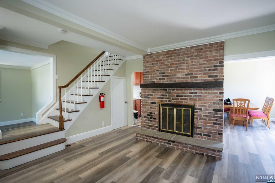 Completed renovated home, New Kitchen, New Floors. Central Air. New Finished attic, New Windows, ,New Bathrooms. New Siding , new driveway . The First Floor has Extra room that can be use as an office or Just a Spare room ,Living Room with Fireplace. Dining Room. Half Bath ,Laundry Room plus a Large Deck. Great for Entertainment! Three Bedrooms On second Floor , Full Bath, Plus a Finished attic with 2 Rooms