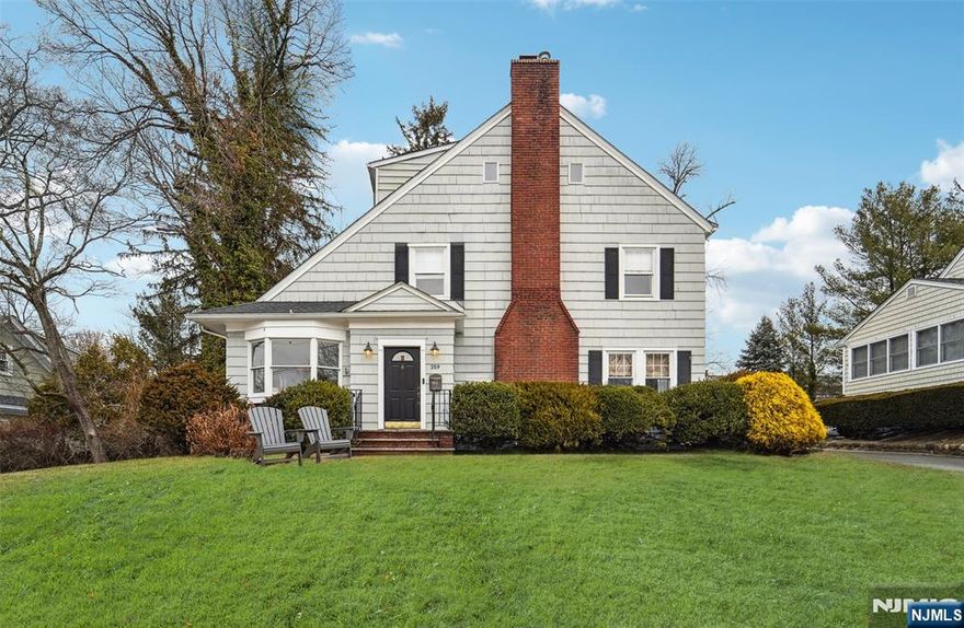 Welcome to the chicest home on the Ridgewood market! This immaculate 4/5 bedroom, 2.5-bath residence offers the ultimate blend of timeless architecture with modern elegance. The energizing open concept features nautical palettes and abundant natural light, highlighted by a designer eat-in kitchen renovated in 2018, with top-of-the-line appliances, an oversized center island and trendy backsplash. Open layout between the kitchen, eating nook and sunlit sitting area, flows to a living room with a fireplace, a sleek dining room with a coffered ceiling and a den/office with built-ins. Mudroom leads to a newly fenced yard with sizable patio ideal for outdoor entertaining. Upstairs, the primary suite offers ample closet space and a luxe bath updated in 2020, 3 more bedrooms, a hall bath, and a versatile 3rd-floor potential bedroom/flex space. Enjoy a newly finished basement (2025), a newer roof (2018), and a 1-car garage. Close to downtown and all 3 public schools - donâ€™t miss this gem!