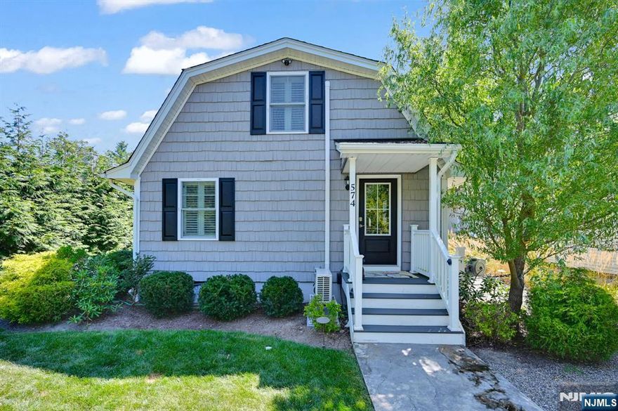 Lovely 3 Bedroom, 2 Full Bath Ranch in Upper Greenwood Lake! Completely renovated in 2019, this storybook home sits above tiered landscaping and offers charm from the moment you arrive. The foyer features built-in cabinetry for storage and an entry bedroom currently used as a home office with added storage space. An open-concept living room with a brick wood-burning fireplace flows into the eat-in kitchen with breakfast bar, high ceilings, recessed lighting, abundant cabinetry, and stainless-steel appliances. The main level also includes a second bedroom, a full bath with tub/shower, and a laundry closet. Upstairs, the private primary suite offers a full bath with stall shower. Step outside from the kitchen to a private patio area with decking, leading to the side yard and a welcoming front fire pit area - perfect for relaxing or entertaining. Additional features include central air, mini-split, and low taxes. All renovations and updates are beautifully finished, making this home move-in ready. Located near ski resorts, Warwick NY shopping, restaurants, wineries, apple picking, a drive-in theatre, hiking and biking trails, and more! Whether as a year-round residence or a weekend getaway, this home delivers comfort, charm, and convenience. Schedule your showing today!