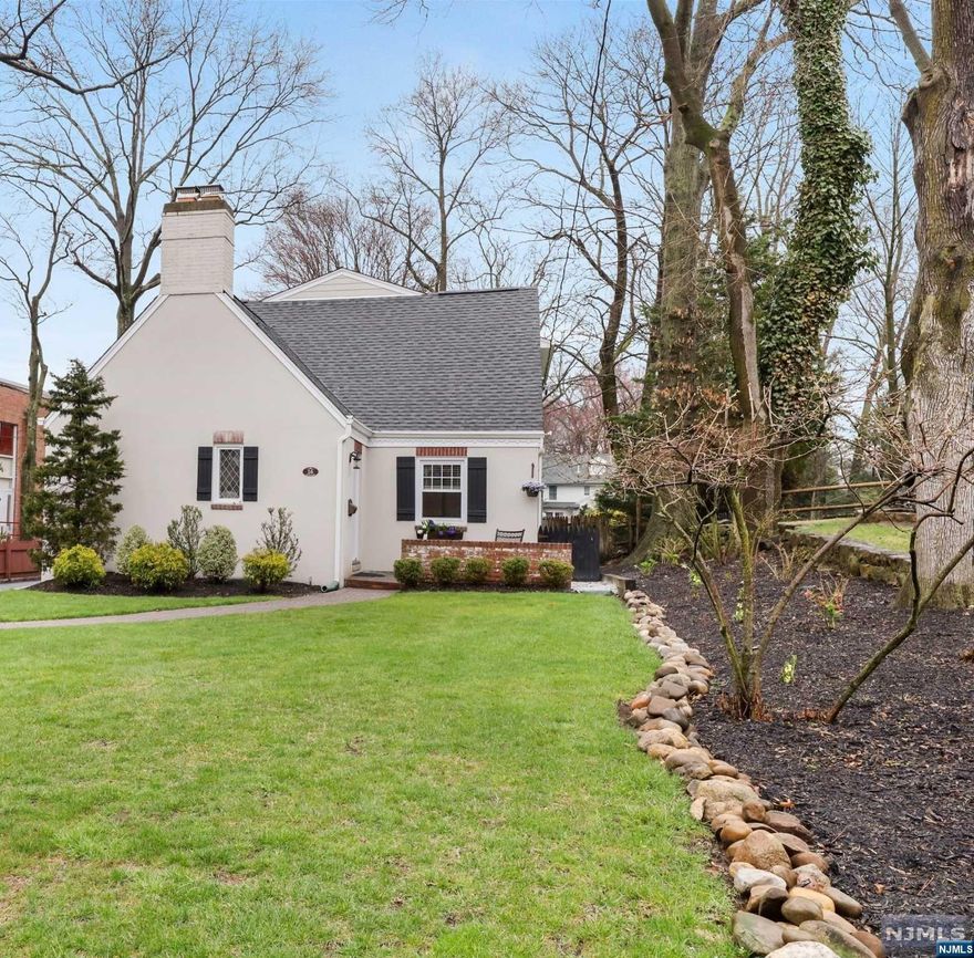 Welcome home to the perfect combination of traditional charm, comfort, and style! Enter the living room of this completely renovated 4-bedroom, 2-bath home and feel the cozy ambiance of a wood burning fireplace, gleaming hardwood floors and original built-in shelving. Off of the living room is a first-floor bedroom, full bath, and dining room leading to a contemporary open-concept kitchen/family room. Sliding doors provide abundant natural light and access to the backyard. A mudroom/laundry room with doggy door offers an additional entryway. The welcoming second floor features a spacious primary bedroom with two walk-in closets, two immaculate bedrooms with over-sized closets, a full bathroom, and roomy hall closets. A fully finished basement with plenty of additional storage closets provides the perfect space for a playroom or tv room. Equipped with invisible fence, sprinkler system, and situated close to town and Demarest's award-winning schools.