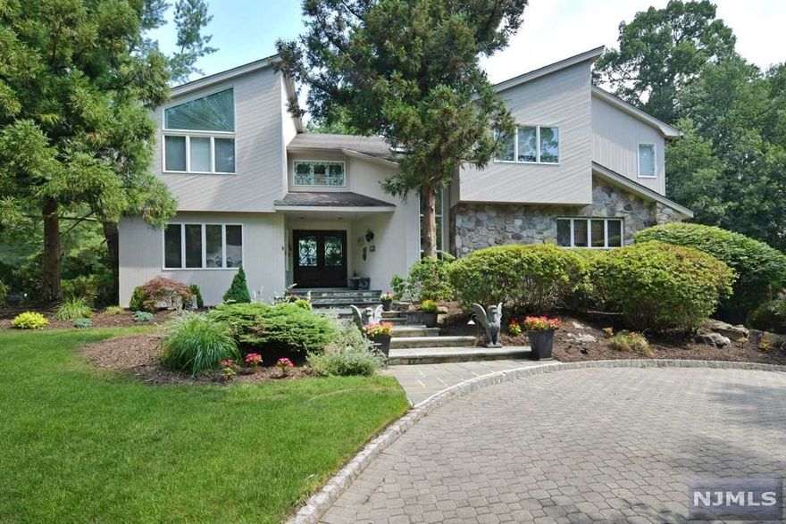 A CONTEMPORARY STYLE HOME TAKEN TO THE NEXT LEVEL. GROUND FLOOR DOUBLES AS AN EXTENDED FAMILY HIDEOUT OR THE BEST PLACE TO HANGOUT WITH ROOM FOR EVERYONE. THE HOME HAS FIVE FPLC, TWO WOOD & THREE GAS. ONE STONE FPLC COMPLETES THE OUTSIDE AMENITIES. THE MASTER BDR HAS IT ALL, 2 WIC, FLR TO CEILING MIRRORS, 2 PERSON JACUZZI AND SHOWER. ALL OF WHICH IS ENCASED IN EXQUISITE ITALIAN MARBLE. OPEN LANDINGS OVERLOOKING THE SPECTACULAR GREAT ROOM (PRESENTLY BEING USED AS THE DINING RM) FAMILY LOVES TO ENTERTAIN! AFTER DINNER, VENTURE OUT TO THE PRIVATE COVERED PATIO WITH BEAUTIFUL LANDSCAPING & LIGHTING.