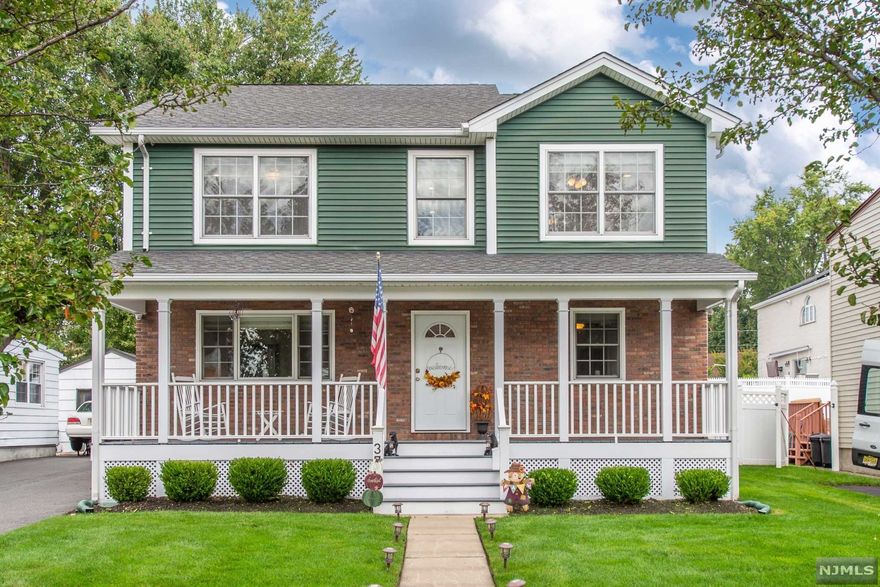 YOUR SEARCH ENDS HERE!! YOUR SEARCH ENDS HERE!! Location, Location, Location. Curb appeal is in full effect with this beautiful colonial located near NYC transportation, shopping, and schools. Enter into the welcoming lemonade porch that leads you into the living room with hardwood floors. Continue through to the kitchen that is bathed in natural light with white cabinets and stainless steel appliances. Large dining room with sliding doors that bring you to a wood deck and custom built stone patio with fire pit. Head downstairs to the basement with a great area for a playroom, office or gym. Laundry room and tons of storage. Make your way to the 2nd floor and you will find the spacious master suite with full bath. 3 additional bedrooms and a bright full bathroom. 1 car garage, shared parking and plenty of space in the backyard that is perfect for entertaining. Walking distance to NYC buses perfect for commuters make this an opportunity that can't be missed!