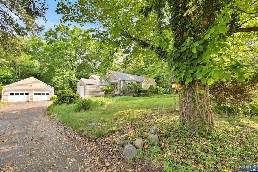 A great chance to own a home in a lovely neighborhood on a beautiful tree lined street. There is a ton of potential for this diamond in the rough. With over half an acre of land, the possibilities are endless. You can create a dream home that perfectly reflects your style and taste. Ideal for an investor or anyone looking for a renovation project!