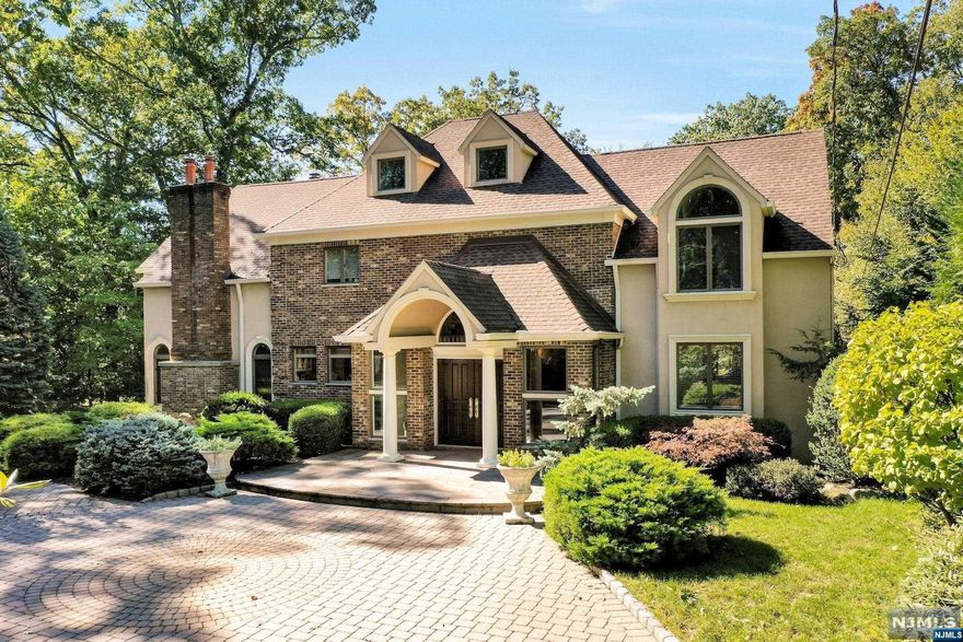 PROPERTY LOVERS! Fabulous, lush .93 acre incredibly private oasis! FF salt water pool/cascading waterfalls, stone patio & walkways, koi pond/waterfall & circ paver block drway! Beautiful Col/wonderful detailing t/o! 4 Brs. 31/2 Bths. 2-sty EF, elegant PR, LR/coffered ceilg opens to FDR/French drs to gourmet Kit. Kit features cust cabs, granite cntrs, ss applcs, center island/limestone cntr & spacious Bkfst Area/French drs opening to deck & amazing rear yard! Inviting FR/fpl. 2nd flr offers luxe PBR Suite/2 WICs, vaulted ceilg, dual fpl & sumptuous PBath/jetted tub/ss, marble flr & fpl. 2 BRs share J&J Bth/sot & another lg BR offers vaulted ceilg, WIC & en suite Bth/jetted tub. Spiral stairs to 3rd level Loft...perfect Off/Bonus Rm. Daylight, w/o LL offers FR/Play Rm, Pantry, Stor/Util Rm, access to 3-car Gar & French dr to rear patio. Add'l feats: Trex deck/auto awning/underneath storage, generator, sprinklers, municipal water, RO filter in Kit & cent vac. Truly a special home!