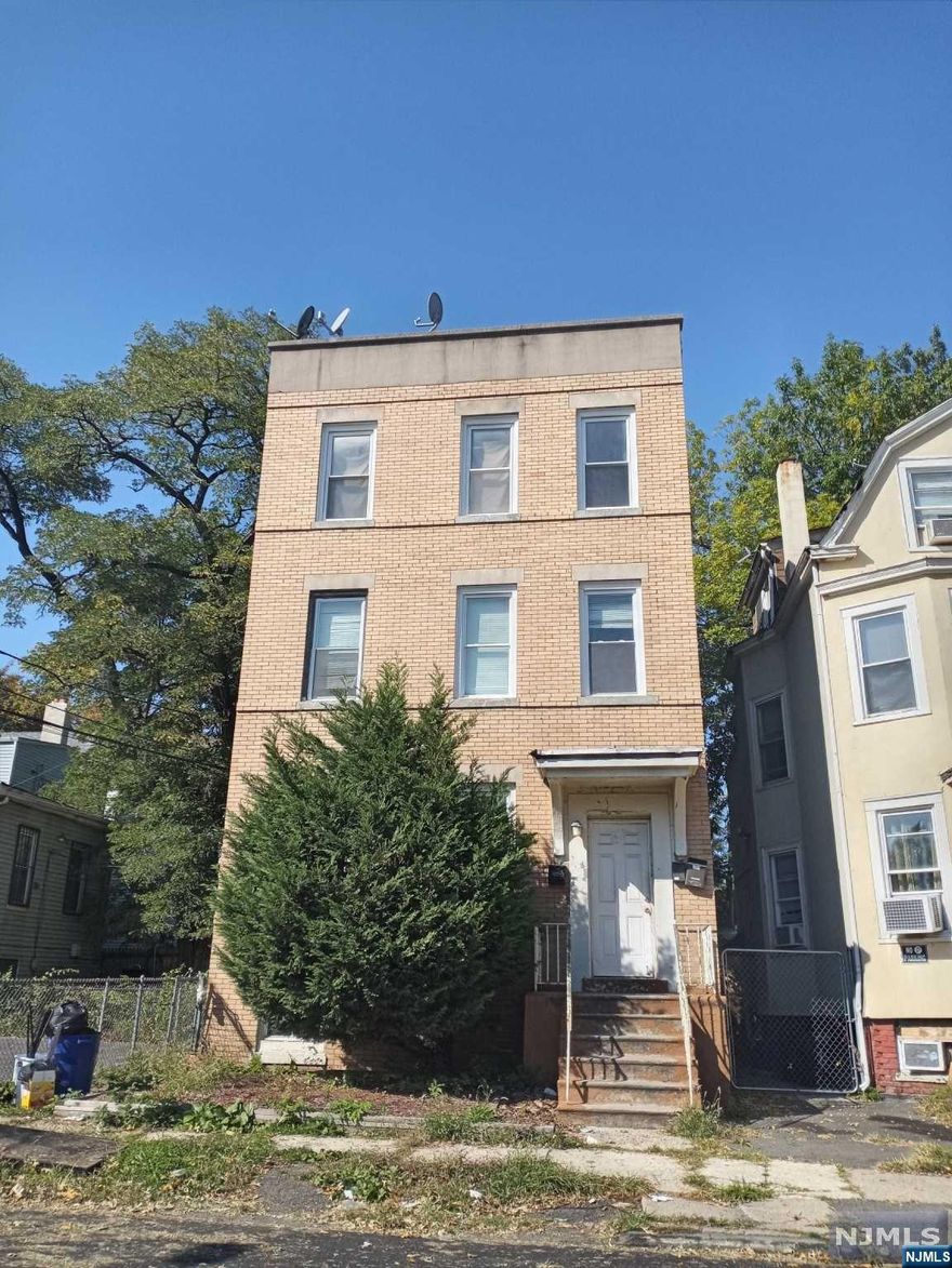 This was built as a 3 family with a full 2 bedroom unit on each floor. Currently being used as 2 family because it has never been thru state inspection. 1st flr vacant and ready for move in. All units same size and overall condition. 1st floor floors have a little more ware and tare. Private yard and Full basement with high ceilings and private entrance. 2 working heating and hot water heaters but 3rd can be easily reconnected. 3 gas and 3 electric meters. All showings is 1st floor and basement only. 2nd and 3rd floor in same or better condition will only be shown upon agreed terms.