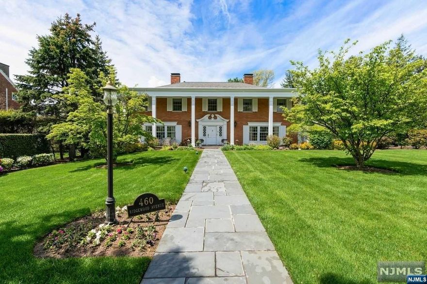 This stately brick colonial lends itself to daily living, yet elegant entertaining. All rooms are sunlit & spacious. A dramatic staircase in the entry hall w/cathedral ceiling, classic living rm, formal dining rm that comfortably seats 12, inviting family rm w/wood burning fireplace, built-in bar & stereo system, custom eat-in-kitchen w/granite counters, stainless appliances, indoor barbecue and sliding doors to the rear patio. A powder rm & lndry rm complete the 1st fl. The 2nd fl boasts 5 bedrms, all with private full baths- two have whirlpool tubs & stall showers. A unique entertainment rm w/wet bar, fpl, his & her powder rms, plus an extensive, finished rec rm and exercise area are located on the lower level. Outdoor enjoyment, on the sprawling stone patio w/built-in barbecue & fire pit area, overlooks the beautifully landscaped grounds. The 3 car garage w/storage loft has entry to both 1st fl and lower level. A sought after location, top rated schools & NYC transportation.