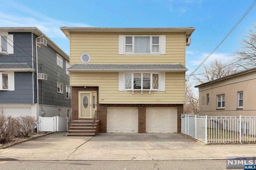 Welcome to your dream home in the charming town of Garfield, NJ! This stunning, 2 family home is now on the market for the very 1st time, offering an incredible opportunity for you to make it your own. W/ 6 spacious bedrooms (3BR in each unit) & 3.5 bathrooms, this home boasts plenty of space for you to live comfortably & entertain guests. The beautiful hardwood floors throughout give the home a warm & inviting feel, while the abundance of natural light creates a bright & airy atmosphere. The full-finished, walk-out basement is a true gem, complete w/ a summer kitchen & full bathroom. Imagine the possibilities for entertaining guests in this versatile space! W/ a 2-car attached garage, you'll have plenty of room for your vehicles. Backyard feat. a beautiful large deck & space for home garden. Located just 1-mile from the train station, this home offers the perfect balance w/ easy access to the city. This well-maintained home is truly a rare find, & you'll fall in love!