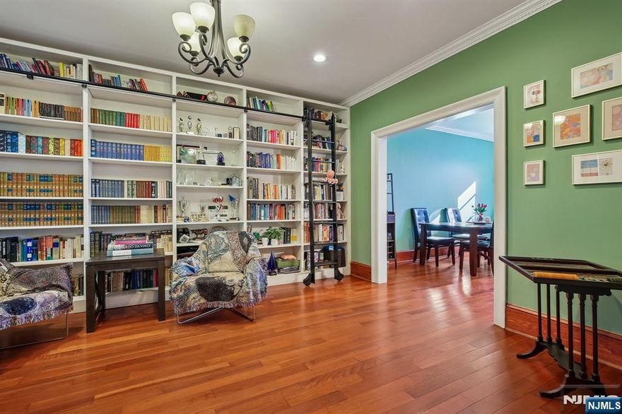 Brooklyn-style brick single-family home in a prime location. This sun-filled 3-bedroom, 2.5-bath residence features an open and inviting layout with high ceilings, bay windows, and East-facing Manhattan views. Thoughtful upgrades include a custom floor-to-ceiling built-in bookshelf with a sliding ladder, a fully updated second-floor bathroom, a new range oven and microwave, and beautifully refreshed details throughout. Beyond the visible charm, the home has undergone extensive behind-the-scenes improvementsâ€”new PVC plumbing, a new electrical panel, and a walk-out basement enhanced with exposed beams, a leveled and tiled floor, a half bath, front and rear access, and a generous amount of storage space. Outside, an added privacy wall enhances the backyard, offering the potential to create your own private retreat. Parking is exceptional with a detached garage plus an additional parking spot directly in front, both located off a semi-private rear street used only by the homes on this rowâ€”an extremely rare convenience in the area. Low taxes add even more appeal. Ideally situated between several beloved parksâ€”Reservoir Park, Memorial Park, and Washington Parkâ€”and just minutes from the Weehawken waterfront and Whole Foods. With direct and easy commuting to Port Authority via NJ Transit at your doorstep, this home offers unmatched convenience. A perfect blend of character, craftsmanship, major system improvements, and an unbeatable location.