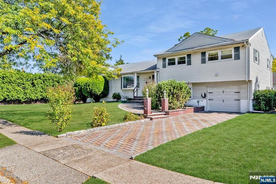 WELCOME TO THIS EXPANDED SPLIT LEVEL IN MONTCLAIR HEIGHTS! Offering five large bedrooms and 3.5 baths, this spacious residence provides the perfect blend of comfort, functionality, and location. The main level features an open, light-filled layout with hardwood floors throughout, a modern kitchen with stainless steel appliances and granite countertops, and ample living and dining space ideal for entertaining or everyday living. Two bedrooms and a full bath allow it to double as a ranch-like experience, with opportunity for a second primary or in-law suite on the main floor with NO STAIRS. Upstairs, youâ€™ll find three more generously sized bedrooms, including a private primary w/ ensuite. The huge finished basement adds even more living spaceâ€”perfect for a home theater, gym, or recreation area. Situated on a large corner lot, this property offers plenty of room for outdoor enjoyment and future expansion. Just minutes from downtown Montclair, and super quick & easy access to NYC commuter options, parks, and top-rated schools, this home combines suburban comfort with unbeatable convenience. Not to mention, a Tesla EV charger and Tesla Solar Panels which are FULLY PAID FOR for maximum savings. Donâ€™t miss the opportunity to make it yours!