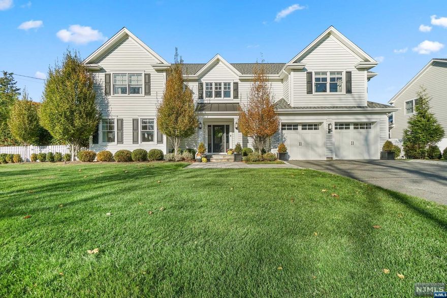 In a tranquil colonial haven, refinement meets opulence, embodying the Architectural Digest dream. Meticulously crafted with premium finishes, the exterior blends colonial charm with modern allure. A designer kitchen unfolds, boasting a new island, marble countertops, and top-tier appliances. The great room captivates with a 10' coffered ceiling and fireplace, complemented by hardwood and ceramic flooring. The master suite, a sanctuary, features a tray ceiling and a luxurious bath. Additional suites, a Jack and Jill bathroom, and a two-car garage complete this masterpiece. The backyard steals the spotlight a Hamptons-style pool, saltwater heated, adorned with custom granite in a sunken hot tub.