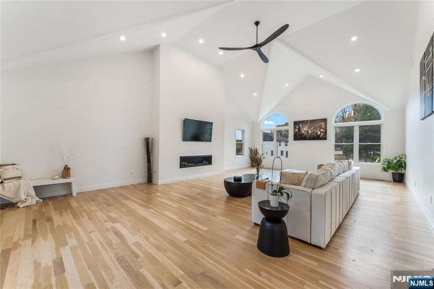 Here's your opportunity to own a stunning Colonial in the highly sought-after area of West Milford, known for its charming community and picturesque surroundings. This exquisite four-bedroom, three-bathroom home is designed to impress at every turn. On the first floor, you'll find a spacious living room, an elegant dining room, and a breathtaking double-story grand family room complete with a cozy fireplace. The eat-in kitchen will be outfitted with top-of-the-line appliances, perfect for culinary enthusiasts. A full bathroom, and a laundry room round out the first floor's offerings. The entire home is adorned with rich dark wood flooring and ample windows, enhancing its status as a luxury residence. The interior design, featuring warm whites and wood accents, perfectly blends sophistication with modern living. On the second floor, you'll discover a luxurious primary suite, along with three additional bedrooms and another full bathroom. Additional amenities include a three-car garage with an electric car charger and a fire pit in the backyard, making it perfect for eco-conscious homeowners and those who enjoy outdoor gatherings.