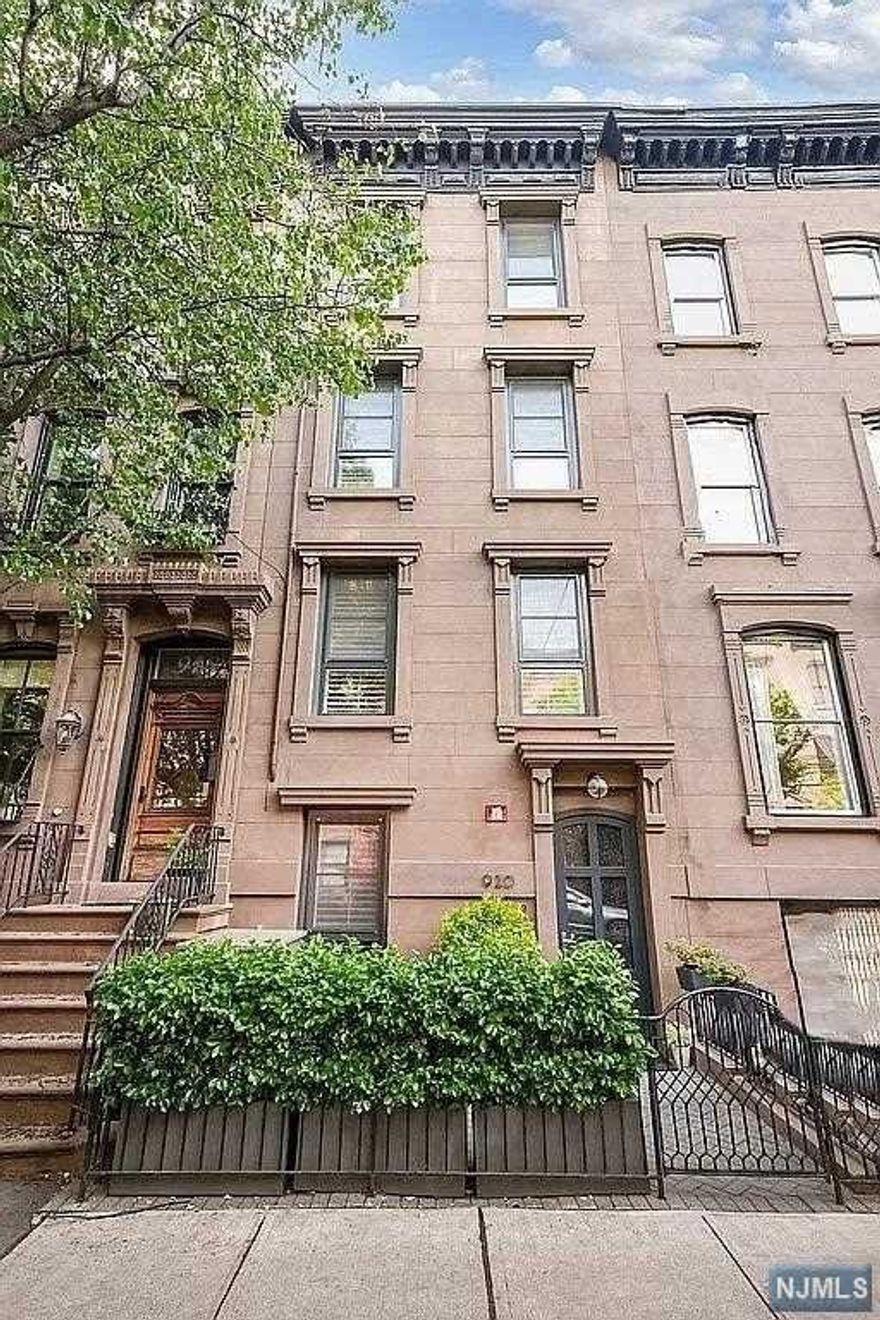 920 Bloomfield Street, this 4-story fully extended single family brownstone was completely gut renovated down to the brick in 2018 and is located on one of uptown Hoboken's most coveted tree lined streets. Behind the meticulously restored fa ade, this exquisite townhome offers approximately 3,700 SF of above-grade living space, high ceilings, a private yard and unobstructed NYC skyline views from your rooftop deck! Built by Red Bridge Homes, a local boutique developer, this expansive open-plan design includes a large living room, four spacious bedrooms, three and a half baths, an enormous media/family room with wet bar, gourmet kitchen featuring hand-crafted cabinetry, well appointed large pantry, two laundry rooms, abundant closets with custom built-ins and a spectacular open-riser white oak staircase. Just off the media/family room is a landscaped yard with bluestone patio and outdoor kitchen with Viking grill ideal for entertaining.