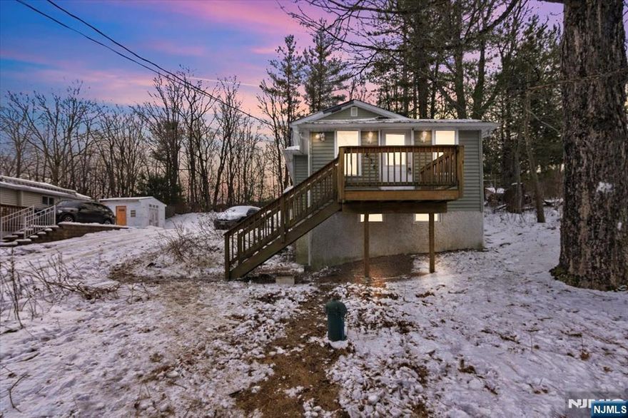 Colonial-style home for sale in desirable West Milford offering 2 bedrooms, 1.5 baths, plus a versatile bonus room, ideal for a home office, guest space, or flex room. This property presents a fantastic opportunity for investors or buyers looking to add their personal touch. Features include a center-island kitchen, a tub/shower bath, and an unfinished basement providing additional potential. Enjoy outdoor living with a rear deck and convenient driveway parking. The home is serviced by well and septic. Ideally located close to multiple lakes, scenic hiking trails, ski resorts, wineries, and a variety of year-round recreational activities. A great value with endless possibilities in a sought-after area.