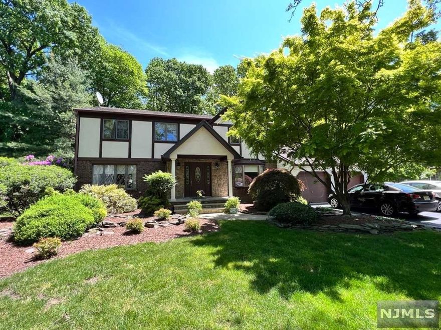 Welcome to this Classic Center Hall Colonial located at end of private cul-de-sac. Incredible layout and space in this expanded, 6 bedroom, 3 Full and 2 Half bath, house, 1st Floor featuring a Large eat in kitchen, gas fireplace and skylights in family room, large living room, formal dining room and separate suite with 2 bedrooms and full bath. 2nd floor features 4 large bedrooms, including a Master suite with walk in closet and master bath. There is a full, finished basement with bar and 1/2 bath. Private rear yard with sun deck and close proximity to Oradell Swim Club. Whole house generator. Ideal for the extended family and those who work from home.