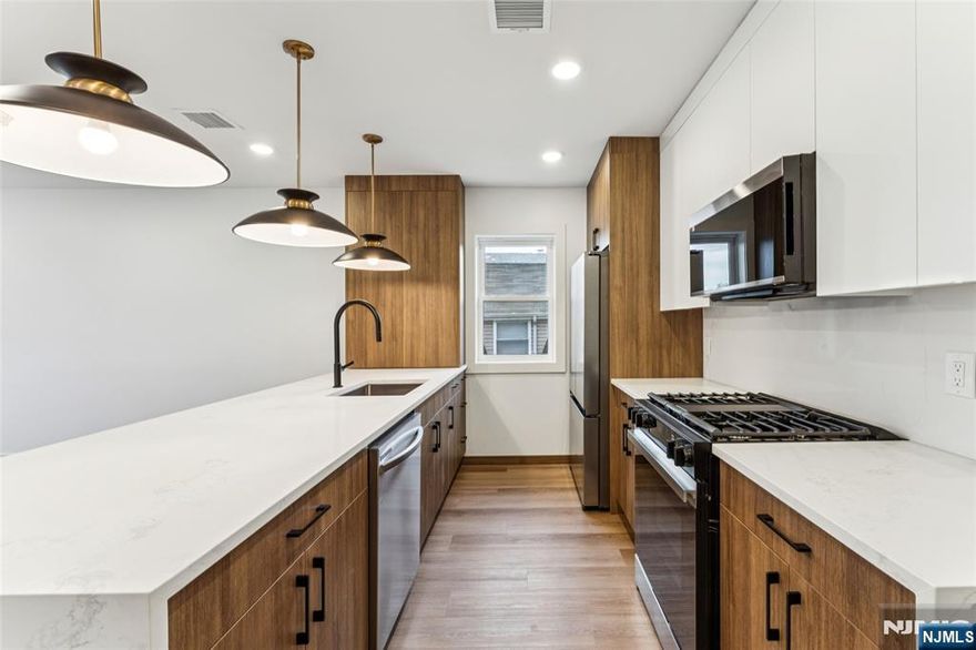 The universe has decided to be generous to apartment hunters with 84 Hollywood Ave, Unit 2! Everything in this brand-new 2025 construction is bright and clean, with no mysterious stains in sight. The one-level layout flows effortlessly, anchored by a kitchen with sparkling stainless-steel appliances, plus a dishwasher for settling dish disputes without a word. Each of the three bedrooms has closets spacious enough to double as side quests. Two full bathrooms help maintain peace on tight schedules, and an in-unit washer and dryer keep laundry pleasantly uneventful. Outside, a huge shared backyard offers room to ponder starting a garden or bask in the day. Ring doorbell security adds to the peace of mind, and the location supplies easy access to the Parkway, 280, NJ Transit buses, a local gym, and places of worship. Unit 2 brings peace of mind to the apartment hunt. Inquire today!