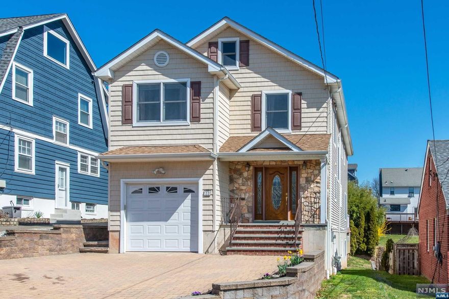 No Place Like Home! Super Convenient Location. Built in 2007, This Custom Colonial Has it All! The Main Levels Offers a Large Open Concept Boasting a Nicely Appointed Kitchen w/Center Island, Granite Counters, Breakfast Bar & Stainless Appliances. Spacious Living Room w/Gas Fireplace and Sliding Glass Door to Rear Deck! Dining Room, A Welcoming Front Foyer, Laundry Room and Powder Room! Enjoy Additional Living Space in the Finished Walk-out Basement with Recreation Room, Office, Full Bath and Utility Room! The Bedroom Level Features a Large Rear Primary Suite with Full Bath, Walk-in Closet and 2nd Gas Fireplace! Three other generously sized bedrooms and a full bathroom. Beautiful Views of NYC Skyline from Front Porch and Winter Views right from the Rear Deck! Walk or Ride to Eagle Rock Reservation just at the top of the street. Minutes to Montclair Shopping, Restaurants and conveniently located near NYC transportation!