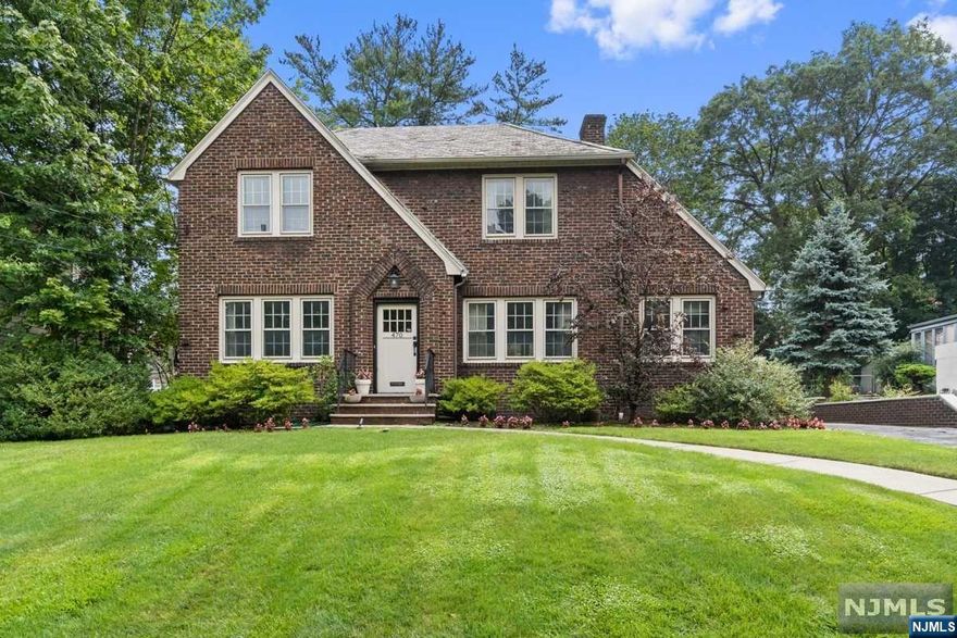 Storybook Tudor is ideal for a homeowner looking to enjoy all the suburbs has to offer with Nutley's wonderful park walking paths directly across the road. Enter into foyer and immediately feel the spaciousness of this home. Kitchen is a chef's delight! The center island is uniquely designed with a second sink, attached stone dining table and plenty of prep space. Viking appliances, two dishwashers and two garbage disposals are sure to please. Two entryways from kitchen provide seamless flow into family room that boasts cathedral, beamed ceilings, skylights & custom bookshelves. Second floor offers a master bedroom with a renovated bath. Additional full bath & three bedrooms complete this floor. Third floor offers possibilities of an office or gym area. Private backyard is a tranquil retreat. Located near coffee shops, restaurants, ON3 campus/Hackensack Medical, & easy commute to NYC with Nutley Jitney on corner to Delawanna train station. Come make this home part of your story.