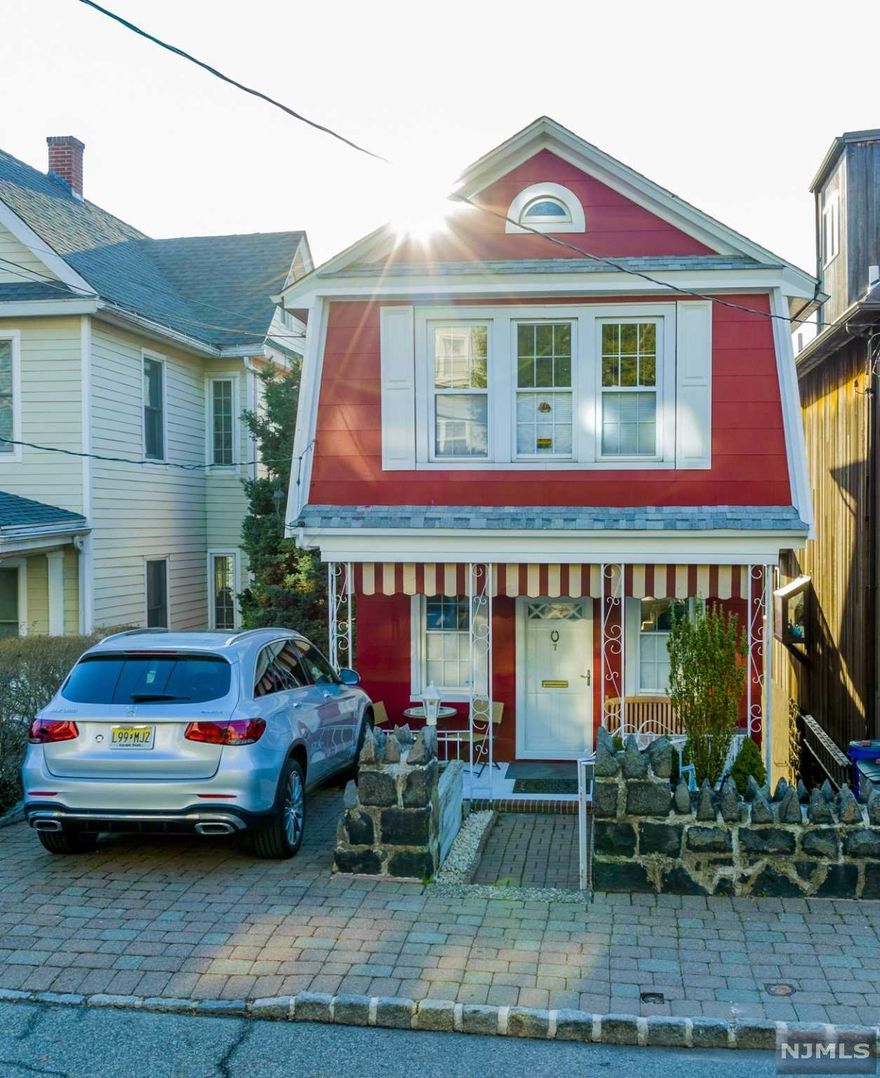 "Ocean Grove" charm meets Edgewater in this East to West facing Dutch Colonel. A 'beach house' type of home too that has year round views. Perched on a hill just above the marina, this house has a unique, up close view of the Hudson River, and Upper Manhattan. The brand new kitchen is nicely proportioned w/crisp white cabinets, recessed lighting, glass tile subway backsplash, granite countertops, & new SS appliances. A new half bath is conveniently located between it and the LR. Plus nice shiny hardwood floors in both the kitchen and living room. The large living room has great views through the bay window and bathes in sunlight. One will enjoy fresh air breezes permeating both inside and out. It has an incredible sun deck that views 'all the action' in the town center, & gets great sun all day. Or relax in the evening sun on the front porch like at the shore and chat with the nice neighbors. Very close to NYC Xpress bus stop, ferry terminal, shopping, and major highways.