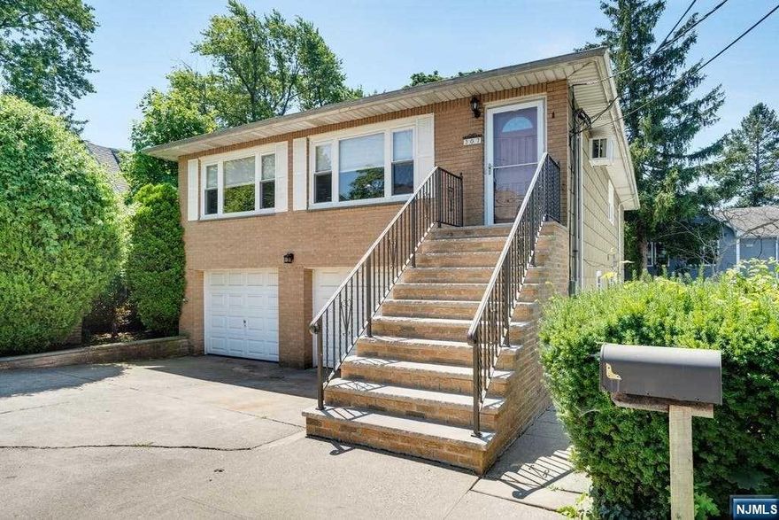 This spacious ranch style home welcomes you into an open living room, formal dining room, and bright eat-in kitchen. Master bedroom with half bath, two additional bedrooms and full bath complete the first level. The lower level offers a bright rec room, storage, office, full bath and access to patio & garage. All windows have been updated within the last 5-7 years except the garage and laundry area window. The roof is approximately 4 years old; the front stoop is approximately 5 years; gleaming hardwood floors; all electric heat. Great location - Close to NYC transportation.