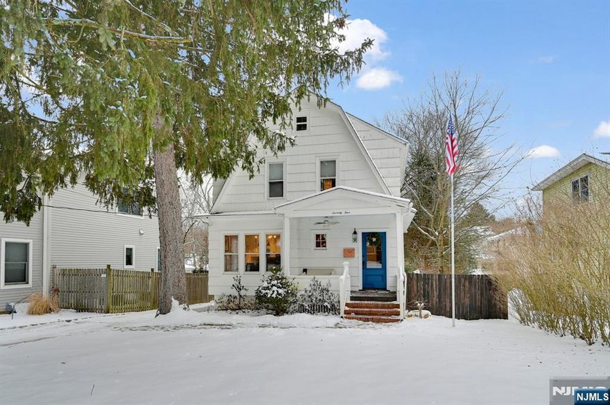 Open front porch welcomes you into this Charming Colonial set on deep property on a quiet tree-lined street. The open floor plan features living room and dining room with natural woodwork and hardwood floors leading to beautiful granite and stainless kitchen with breakfast bar, updated powder room and laundry. Upstairs you will find the primary bedroom suite with renovated bathroom, second and third bedroom, newer main bathroom and walk-up attic access. There is a finished rec room in the basement and storage area. The shed is a perfect home gym! Just a short walk to top rated Park Ridge schools, NY transportation, shopping, and restaurants.
