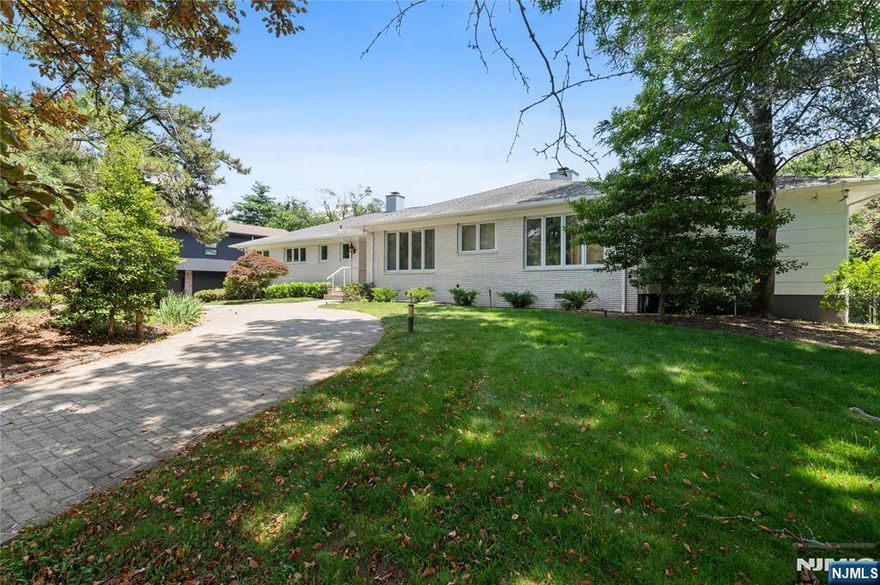 Elegant Brick Ranch in the Heart of South Orange Welcome to this beautifully expanded brick ranch nestled in the heart of charming South Orange. This sophisticated residence offers effortless one-level living, beginning with a gracious grand foyer that sets the tone for the elegance found throughout the home.An open floor plan seamlessly connects the spacious living and dining areas, perfect for entertaining. Gorgeous hardwood floors run throughout, adding warmth and timeless appeal. The expansive family room features sliding glass doors that open to a tiered patio overlooking a professionally landscaped half-acre property. The serene garden, filled with mature plantings and enhanced by an underground sprinkler system, offers a peaceful, private escape.From your home and backyard, enjoy stunning east-facing skyline views and take in both sunrise and sunset, creating a tranquil atmosphere day and night. The finished basement adds even more space and versatility to this already impressive home. With its classic brick and cedar siding, this home is as beautiful outside as it is within.Don't miss the opportunity to make this exceptional, picture-perfect property your own. Schedule a private tour today. House # is 206. GSMLS Lbx and Combo. Vacant and easy to show.Partially renovated and in move-in condition. Inspection subject to major structural issues only.