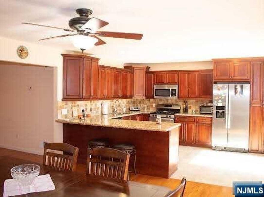 WELCOME HOME TO THIS APPROX 3800 SQFT HOME. BRICK EXTERIOR AND PERFECTLY APPOINTED THROUGHOUT. THIS HOME OFFERS (2) ENSUITE'S PERFECT FOR A HOME OFFICE OR EXTENDED FAMILY WITH A PRIVATE ENTRANCE. FIRST FLOOR OFFERS A DOUBLE GUEST CLOSET, FORMAL LIVING ROOM WITH A DOUBLE-SIDED FIREPLACE, FORMAL D/R, LARGE EIK 15X20 WITH SLIDERS TO LOVELY 14X14 DECK WITH AN ENTRANCE DOWN TO THE YARD. SWITCH BACK STAIRWELL CASCADING TO THE SECOND FLOOR OFFERING WITH A PERFECT LANDING TO CREATE A READING NOOK. LARGE MASTER EN SUITE WITH CATHEDRAL CEILINGS, BDRM, BDRM, BDRM, F/BATH AND BRESSLER STEPS TO A HUGE ATTIC. THE LOWER LEVEL HAS THE MECHANICAL ROOM, A PRIVATE ENTRANCE, FAMILY ROOM, HOME OFFICE AND GARAGE. PLAUDERVILLE TRAIN STATION IS 1/2 MILE, NJ TRANSIT IS WITHIN WALKING DISTANCE. COUNTY PARK WITH 14 MILES OF STREAMS AND PATHS TO ENJOY. A TOWNSHIP THAT OFFERS A QUAINT PEACEFUL PLACE TO CALL HOME.LOW LOW TAXES