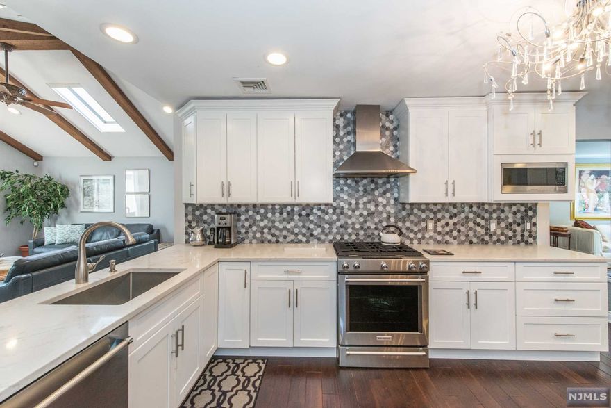 Imagine...an impeccably designed home w/ all the lux. details you dreamed of, located in prestigious neighborhood of Montclair Hgts. & offering the comforts of easy 1 floor living w/ an easy commute to NYC only 13 miles away. Expect the finest materials & workmanship throughout this completely remodeled home w/ gourmet kitchen feat. expertly crafted cabinets, quartz stone counter tops, stainless steel appliances, hardwood floors & elegant light fixtures. Open floor plan offers a modern style w/ a relaxed yet sophisticated setting perfect for gathering family & friends in the light filled family room w/ high beamed ceilings & access to deck, formal living room or in the cozy dining room. There are 3 bedrooms & 2 elegant baths including 1 en suite. This stunning home also features a spacious finished bsmt w/ high ceilings & plenty of storage incl. a cedar closet. Enjoy outdoor living on the deck w/ canopy for shade or on the beautifully manicured yard. Newer A/C & Heating Unit.