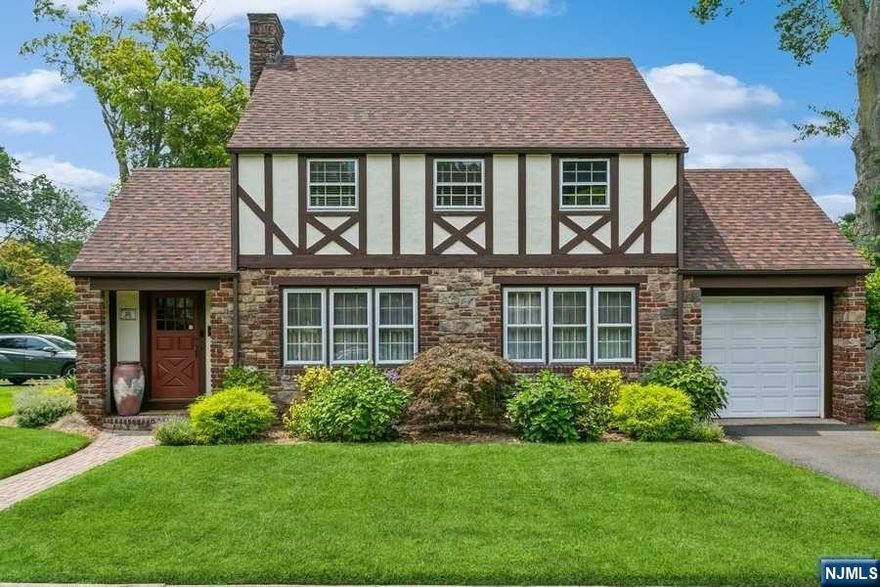 Welcome to this charmingly updated home located on one of Tenafly's most beautiful streets. Conveniently situated within a close distance to the elementary school, downtown bus stops, and places of worship, this home offers both convenience and comfort. Recently renovated, the new kitchen adds a modern touch to the classic design. The second floor boasts three bedrooms and a full bath, while the first floor features a half bathroom. The fully finished basement includes yet another full bath, providing ample space for various activities. With a one-car garage and lovely landscaping, this sweet home is sure to captivate your heart. Don't miss this opportunity to make it your own!
