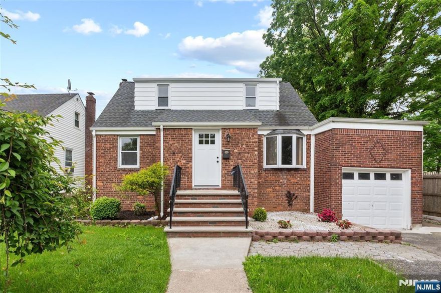 Discover this stunningly renovated 5-bedroom, 2-bath home nestled in a prime Bergenfield location! The first floor welcomes you with an airy open layout, bright living and dining areas flow seamlessly into a gorgeous brand new kitchen with stainless steel appliances and contemporary finishes. Step through new sliding glass doors onto a cozy deck overlooking a private, fully fenced backyard. Two bedrooms and a sleek full bath complete the main level. Upstairs, enjoy a spacious primary bedroom, a generous second bedroom, and a custom walk-in closet that can easily be converted back into a fifth bedroom, plus a second full bath. A finished basement offers endless possibilities; playroom, home gym, office, or more. With a new roof, newly installed water heater, and thoughtful updates throughout, this home is truly turn-key. Conveniently located near schools, parks, shops, and NYC transit, this one checks all the boxes!