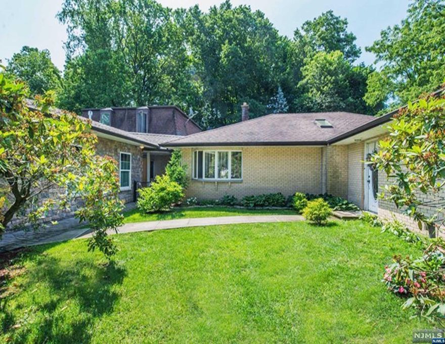 Welcome to this UNIQUE 2 family home that's approximately 3,366 SQFT. Fantastic location on a Cul de Sac. The main house is a Ranch style home which includes 3 large Bedrooms, 3 Full Baths. Open Floor plan offers spacious Living Room w/Fireplace w/gas line, Formal Dining Room with imported tile. Massive Family Room that opens to the Kitchen which is ideal for entertaining. Incredible Bamboo Cathedral Ceilings with amazing custom lighting. BONUS - OVERSIZED HEATED GARAGE that fits 4 Cars tandem. Separate electric box for an Electric Vehicle. LEGAL Studio Apartment on the 2nd floor with approx. 650 sq. ft updated Kitchen, Washer & Dryer Included. Loads of closet, separate entry plus fenced in yard for privacy. Main home features a back yard Oasis. Heated Inground Pool & Hot Tub, 2 storage sheds and COMPLETELY PRIVATE! Located close to public schools, Major Highways Rt. 80 & GSP minutes away. Access to transportation to NYC nearby and a commuter dream to NYC. ABSOLUTE MUST SEE!