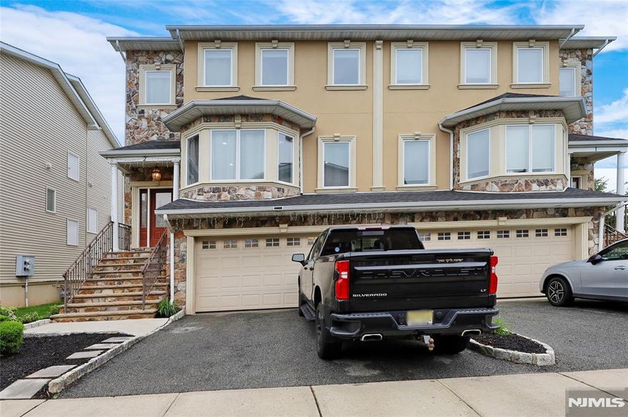 Experience luxury waterfront living in this expansive, meticulously maintained townhouse in the safe and desirable community of Secaucus, NJâ€”just 20 minutes from Midtown Manhattan with a direct bus stop outside the community. Located along a scenic 2-mile riverfront boardwalk with parks, nature trails, and open space at your doorstep, this home offers the perfect blend of comfort and lifestyle. The first floor features a 2-car garage with 220V EV charging, a second fridge, custom storage including a kayak lift, a full bath, and a large flex space with a fireplace and Amish-built maple wall unit with Murphy bedsâ€”ideal for guests or multigenerational living. The main level includes a bright living room, half bath, and chefâ€™s kitchen with a fireplace, stainless appliances, and balcony with river views. Upstairs is a spacious primary suite with vaulted ceilings, two walk-in closets, a spa-style bath with skylight, jetted tub, glass shower, double vanity, electric bidet, and private balcony. Two more bedrooms, a full bath, and laundry room complete the top floor. Additional upgrades include towel warmers, whole-house humidifier, stereo wiring, and security system. Residents enjoy access to Secaucus' free municipal pool and low-cost rec center with indoor pool, gym, and classes. Offered by its original owner, this exceptional riverfront home is a rare find.