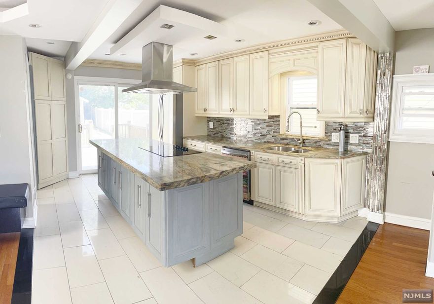 Welcome to this 3 bedroom 2 and a half colonial. Beautifully designed open floor concept welcomes you into this charming home. First floor features living room, dining area, modern kitchen with island, custom cabinets and beautiful quartz countertops. Sliding doors from kitchen to a private fences patio with deck, storage shed. Upstairs awaits you three bedrooms and a powder room. Finished walkout basement with full bath and summer kitchen. Central heating and cooling, tankless instant water heater washer, dryer and many more features to list. Conveniently located close to NJ highways, public transit and walking distance to shopping. Why rent when you can own!