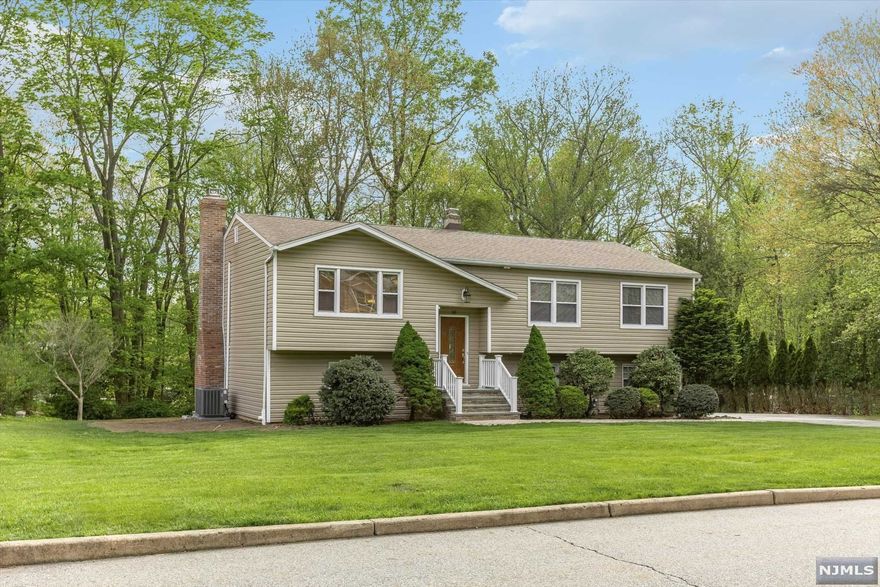 Fantastic Cul-De-Sac Location! Totally Renovated Bi-level features an Open Floor Plan, Stunning Master Bedroom Suite Addition, Master Bath, Walk in Closet, MEIK w/Granite Tops and Door Leading to Deck, Stainless Steel Appliances, Family Rm w/Brick Fpl, Glass Sliders to Patio, Nwr Siding, Nwr C/A, Fresh Paint, New Flooring, 3rd Bedroom wall can go back for 4th Bedroom (Septic is 4 Bdrm Town Verified), Nwr 3 Zone HWBB Heat, 2 Car Built-in Garage with Newer Doors, Large Driveway, Private Yard, Plus Conveniently Located Close to Schools & NJ/NY Transportation! Seller to install new Septic. This is a Must See! Won't Last!