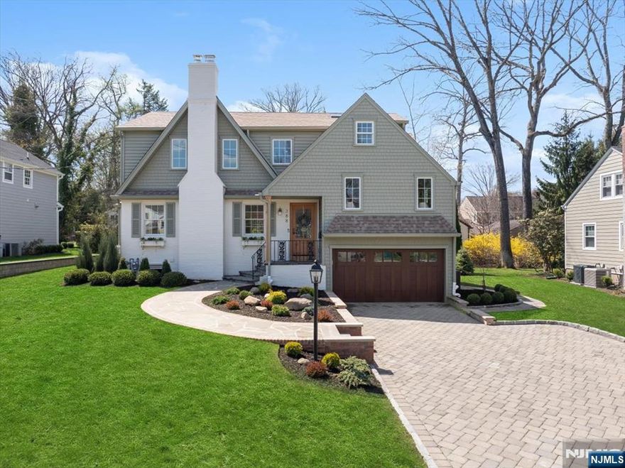 Expanded and fully renovated in 2025, this one-of-a-kind home sits on a quiet residential street in the premier Willard district, just around the corner from Habernickel Park. Professionally designed by an interior designer, this custom home strikes a balance between timeless design & everyday functionality. Exuding charm & meticulous attention to detail, the home features 5 bedrooms & 3.5 bathrooms, with custom millwork & designer lighting throughout. The stunning kitchen includes custom inset cabinetry, built-in appliances, a soapstone island & marble countertops. Outswing dining room doors open directly to a Trex deck, creating an easy indoor/outdoor flow. Warm and inviting, the sun-filled living room features a large bay window & wood-burning fireplace. Upstairs, the primary suite feels like a retreat with two custom walk-in closets & oversized en suite bath with radiant heated floors & a custom double vanity. Additional bathrooms are equally as breathtaking, including a hall bath with a marble sink, and a custom double vanity with Taj Mahal quartzite countertops in the 3rd bathroom. The lower levels have a mudroom & office, porcelain tiled laundry room, & a fully finished basement/family room. Outside, the property continues to impress with its charm. It includes a paver driveway, two-car garage & expansive two-level backyard. A rare offering in Ridgewood reflecting detail in every corner. CALL LISTING AGENT JEFF FEAGLES AT 201-803-9624 FOR INFO AND SHOWING.