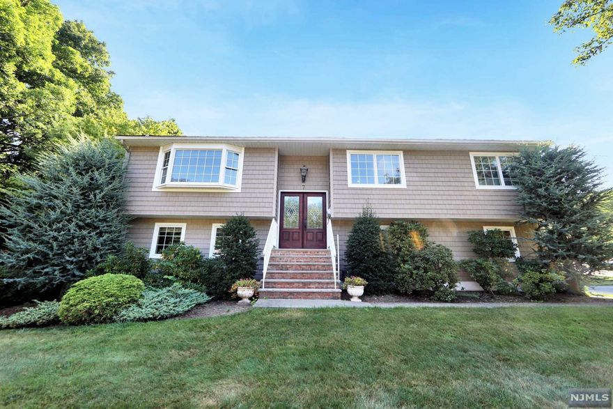 WOW! Just unpack the bags and move right in! Meticulously maintained 3 Bedroom 3 Bathroom expanded Bi-Level with IG Pool. Located on one of the most desirable streets in Bloomingdale. First floor with open floor plan, living room, dining room, large updated kitchen with Sub Zero refrigerator and Viking stove. Great room lined with windows overlooking the yard. Beautiful Oak hardwood floors throughout the first floor, two bedrooms, updated full bathroom, master bedroom with updated master bathroom completes this level. Lower level with family room, fireplace, updated full bathroom, beautiful four season sunroom overlooking large in-ground pool. Two car garage converted into rec room with sink and cabinets which can be switched back to garage. Features include Anderson windows, whole house Generac generator, and underground sprinklers. Just a block away from Bogue Pond and playground.