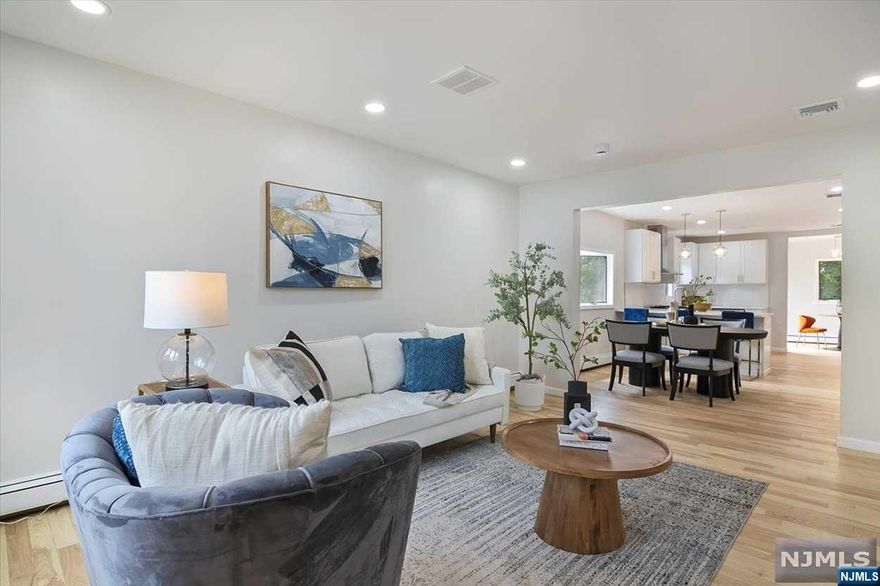 Welcome to this charming and deceptively spacious ranch home in the desirable suburb of West Orange. You'll be impressed as you step into a completely modern and open-concept space. The living room flows seamlessly into the dining room which leads directly into the kitchen with separate breakfast nook. Have your morning coffee and evening tea in this cozy area or take advantage of the sliders that directly lead to an enormous wrap-around deck with western views. Back inside, the main level has two bedrooms with large closets and a bathroom. Downstairs, the walk-out basement has a family room, another bedroom, full bath, laundry area and additional bonus room/storage. Outside you have a long driveway and detached garage. A private and shaded backyard is a perfect retreat on those hot sunny days. Unbeatable location close to public transportation, shops, schools and highways. Easy access to NYC. This is one you don't want to miss.