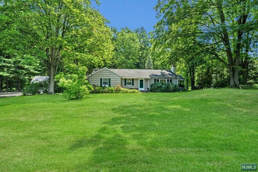 Tranquility! Surround yourself with nature and beauty. This charming Ranch is nestled on an expansive piece of park-like property. The possibilities are endless. Lovely 3 bedroom home with 2 full baths. Open and airy Floor Plan. The Solarium Dining Area allows sunlight to stream in bringing the outdoors inside. Cherry Kitchen, Large Living Room with a Dining Room Area complete with a Fireplace and a French Door slider leading to the large Deck. A Full finished Basement with a Family Room, an Office with a Double Closet, and a Full Bath. Need room for several cars or a work space? Not a problem! 1 Car Attached Garage and 2 Car Detached Garage. Come see this gem!