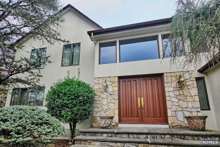 **Accepted Offer** Come and see this hidden gem on a quiet cul-de-sac in Closter! This spacious home has everything you could ask for! Get ready to be amazed when you first open the door to the vaulted entranceway with a stunning crystal chandelier that gleams with the amount of natural light that this home has. Including 5 and a half baths, 6 beds, a master bedroom with a California closet and master bath with jacuzzi, an open concept basement, and a massive kitchen with an island, this house has enough space for any need. The top floor has new carpeting, the ground floor has birch hardwood floors, and the finished basement includes a laundry room and wet bar for endless opportunities. The Exterior has been freshly painted and the yard was recently landscaped, with a sprinkler system for some peace of mind. The two-car garage with space for an additional three cars in the driveway ensures you will always have room for guests. This will not last!