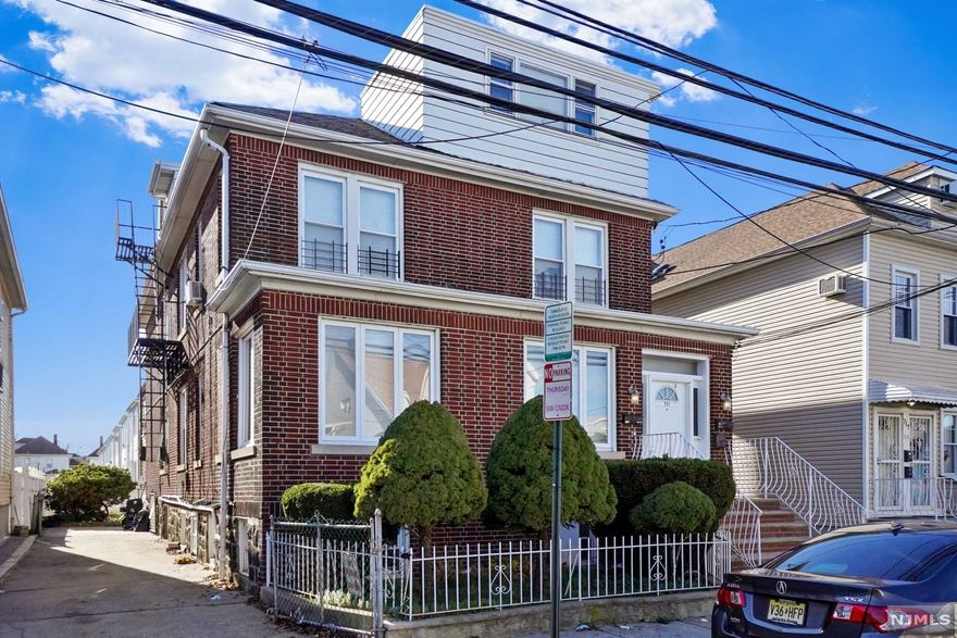 RARE opportunity to own this one of a kind property located in the Racetrack Section of North Bergen. ALL BRICK legal two family with walk up attic sits on an oversized 50x100 lot with TWO driveways (one on each side of the house) + a detached garage. Inside there is over 4100 square feet (per hudson county tax records) of living space across 3 fully finished floors featuring 8 bedrooms and 5 bathrooms. Not to mention the semi-finished basement with enormous potential featuring 3 bonus rooms and 1.5 bathrooms. Showings begin at open house on 2/30!