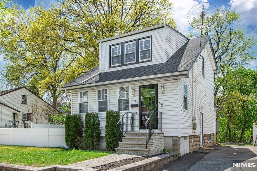 ABSOLUTELY ADORABLE, WELL-MAINTAINED THREE-BEDROOM COLONIAL NESTLED ON QUIET, TREE-LINED STREET IN HIGHLY SOUGHT-AFTER NEIGHBORHOOD. This home blends classic character with modern updates. The main level welcomes you with a spacious living room and formal dining room with sliders to a large deck, perfect for dining alfresco. The home features gorgeous hardwood floors throughout and includes a convenient first floor mud room and powder room. The heart of the house is a sleek kitchen equipped with SS appliances, including a gas stove, double-door fridge, microwave and dishwasher. Upstairs you will find three spacious bedrooms and a pristine full bath. The finished basement offers incredible versatility with an additional full bath, a bonus room for storage and hook ups for washer/dryer. Step outside to enjoy the expansive, fenced backyard complete with storage shed. Ideally located close to parks, schools, shops and dining for the perfect combination of suburban tranquility and everyday accessibility. New roof and furnace (2023). Water heater (2022)