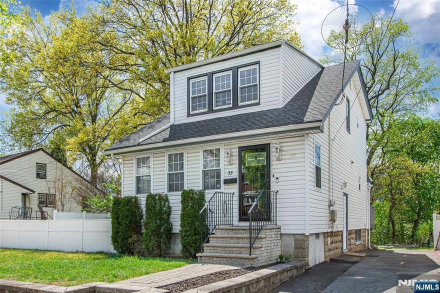 ABSOLUTELY ADORABLE, WELL-MAINTAINED THREE-BEDROOM COLONIAL NESTLED ON QUIET, TREE-LINED STREET IN HIGHLY SOUGHT-AFTER NEIGHBORHOOD. This home blends classic character with modern updates. The main level welcomes you with a spacious living room and formal dining room with sliders to a large deck, perfect for dining alfresco. The home features gorgeous hardwood floors throughout and includes a convenient first floor mud room and powder room. The heart of the house is a sleek kitchen equipped with SS appliances, including a gas stove, double-door fridge, microwave and dishwasher. Upstairs you will find three spacious bedrooms and a pristine full bath. The finished basement offers incredible versatility with an additional full bath, a bonus room for storage and hook ups for washer/dryer. Step outside to enjoy the expansive, fenced backyard complete with storage shed. Ideally located close to parks, schools, shops and dining for the perfect combination of suburban tranquility and everyday accessibility. New roof and furnace (2023). Water heater (2022)