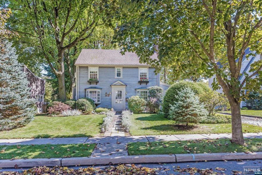 Beautifully finished home across two levels with a sleek, minimalist design, generous rooms, and a partially finished basement.The Interior features include dark hardwood doors, Carrara marble, builtins, recessed lights with dimmers, and central air conditioning (Nest). Front-to-back living room with fireplace, adjoining office with rear-facing bay window, and a formal dining room with front bay window. Renovated kitchen with custom cabinets, Carrara marble counters, high end stainless steel appliances. Partially finished lower level features an office/playroom, full bath, laundry area, and open storage/utility area. Wood Cedar shingles exterior, detached garage with automatic garage door opener, and patio overlooking a spacious backyard. Landscaped property includes mature trees, shrubbery, and established lawn. Prime location close to Upper Montclair Village, houses of worship, NYC transportation. Upper Montclair address with Clifton taxes!