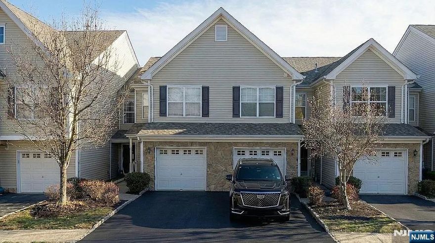 This beautifully updated townhouse offering approximately 2,000 sq ft across three levels, with 3 bedrooms and 3.5 bathrooms. The main level features open floor plan with both an eat-in kitchen with generous breakfast bar and formal dining and living room with hardwood floors, recessed lighting, and a gas fireplace, ideal for everyday comfort and entertaining. The kitchen is impeccably updated with Zodiaq quartz countertops and stainless-steel appliances. Upstairs, the primary suite offers a cathedral ceiling, walk-in closet, and a spa-like en-suite bathroom with double vanity, soaking tub, and separate stall shower. Spacious second bedroom with a private en-suite bathroom, ideal for guests or a home office setup. The townhouse includes third oversized bedroom on the walk-out lower level with a private bathroom and two walk-in closets. While located on the lower level, the space benefits from direct exterior access. Recent improvements include a brand-new driveway, new roof, and updated HVAC/heating system and hot water heater. Enjoy Highlands community amenities including an in-ground pool, playgrounds, cold water included, snow removal, landscaping, and tree maintenance. Conveniently located near downtown Pompton Lakes and close to NYC-bound bus options, this townhouse offers space, comfort, and low-maintenance living.