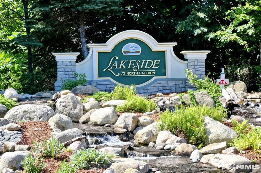 Beautifully updated townhouse in Lakeside. Recently painted. The first floor features a living room, dining room, great room with gas fireplace and vaulted ceiling. The kitchen boasts stainless steel appliances and stone countertops. Additional features include a powder room and attached garage. The second floor offers a spacious master bedroom with custom closets, master bathroom with double sink and tub. Two additional bedrooms, a hall bathroom, and laundry room with new washer/dryer complete the space. This stunning property showcases breathtaking views of the NYC skyline. Residents can enjoy resort-style living, complete with numerous amenities including clubhouse, fitness center, tennis courts, pool, lake access, boating and fishing. The location provides easy commuting options to NYC and beyond.