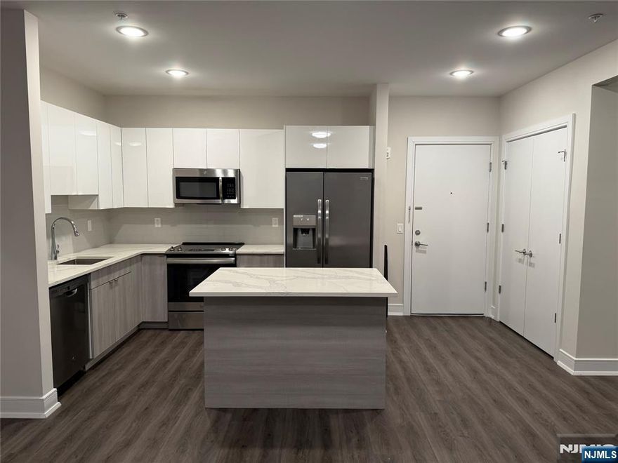 **ONE MONTH FREE on 13-month lease + one parking space included! - for occupancy commencing on or before 6/1/25!** Welcome to the Metro, Fort Lee's newest luxury building. All amenities INCLUDED in the rent, and REDUCED rent security offered to qualified applicants - The Metro features a variety of upscale, spacious floorplans. high-end residences fully equipped w/ modern kitchens w/ stainless steel appliances, quartz countertops, full islands & tiled backsplashes, open living/dining areas, shades on all windows, modern bathrooms & a full-sized washer & dryer in each unit. The Metro features a large elegant lobby, outdoor courtyard, outdoor terrace/garden, large club room and a on-site fitness center, which includes the Echelon Reflect mirror, electric car charging stations & INDOOR (covered) parking garage w/ direct elevator access to all residences for uncompromising security. Pet friendly (LB limit & fees apply)! Tenants pays ALL utilities. PARKING: 1st assigned garage parking space - $150/mo (excluding promotion) ; 2nd assigned garage parking space - $100/mo. Virtual tour available upon request!