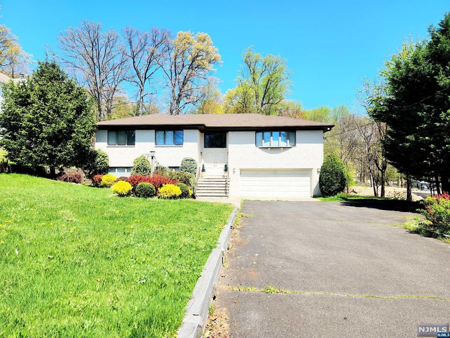 Welcome home to this beautiful, bright, spacious home in the highly sought after Township of Washington on the border of Ridgewood! Settle into almost 4,000 square feet of living space! The amazing curb appeal will grab you as you pull up to this stunner sitting on an oversized half acre lot! Plenty of parking with a spacious 2 car garage. 1st Floor Features: Huge eat-in-kitchen, large living room w walk-out to a beautiful deck, spacious dining room, nice master BR w master bath & walk-in closet, & two additional BRs! Ground Level Features: Extensive family room which is plumbed for a possible kitchenette for extended family use or a potential bar for entertaining, very large BR w huge walk-in closet, full bathroom, laundry room, additional flex space, plenty of storage, and access to the backyard! Step out to the unbeatable backyard with amazing space for relaxing or entertaining! There is also a storage shed for your convenience. Don't miss it! This home will not last!