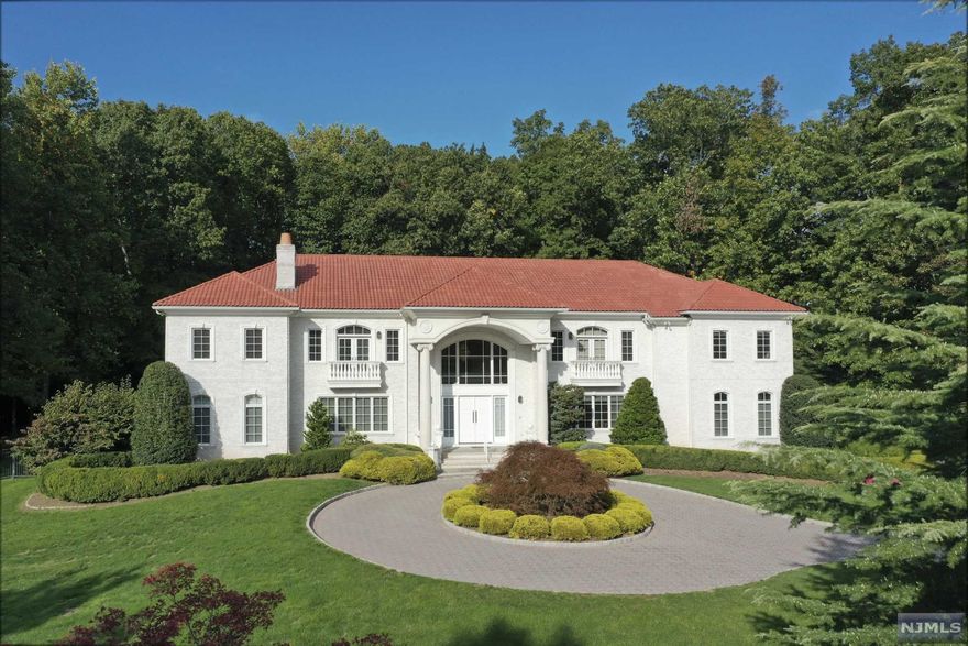 Exquisite custom built manor of approx. 8100 sf is situated at the cul de sac on the most sought-after street in Saddle River, lined with multi-million $ estates. Young, all brick European Villa sits majestically on 2+ acres with panoramic views! Grand 2-story marble entry foyer with domed, hand-painted ceiling, open floor plan, walls of glass, French doors, formal living room w/fpl, formal dining room w/butler's pantry, great room w/fpl, billiard room w/fpl, pub room. Incredible chef's kitchen w/high-end appliances, vaulted, sun-drenched breakfast room w/access to yard, huge primary bedroom suite w/French balcony, custom walk-in closets + luxurious bath. 4 additional bedrooms all w/ensuite baths, French balconies, walk-in closets. 10'+ ceilings throughout. Perfect for working remotely. Huge lower level w/outside entry, 4-car garage, paver driveway. Bluestone veranda leads to heated pool, spa and waterfall. Professional, lush landscape of stunning specimen trees. Low, low taxes!