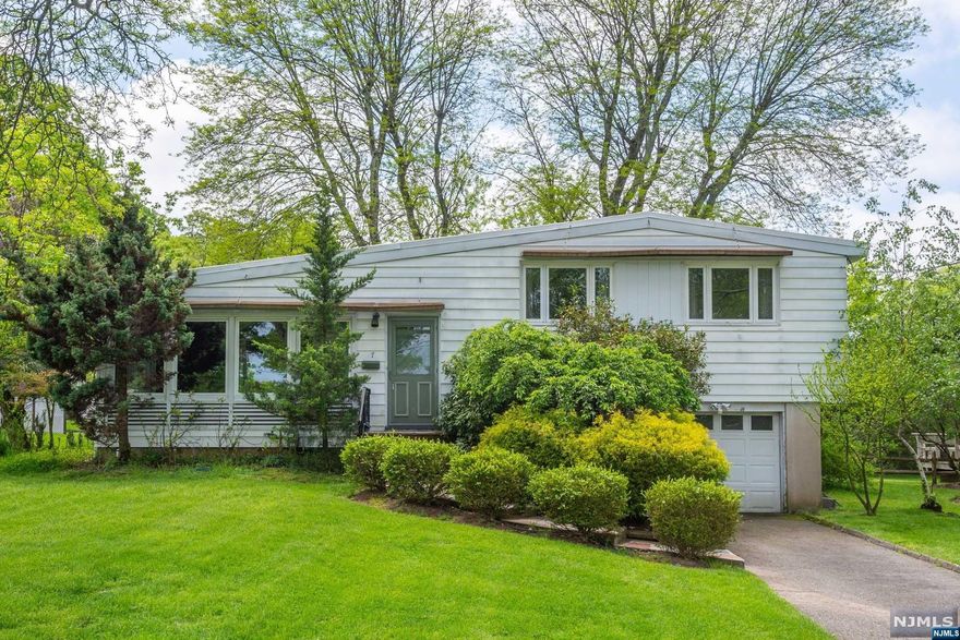 ***HIGHEST & BEST DUE FRIDAY 5/24 10AM*** Don't miss this opportunity to own this 3 BR, 1 1/2 bath split level on a beautiful tree lined street in desirable Cedar Grove! Renovate to your taste, the possibilities are endless! This home features a generous size living room w/gas fireplace & vaulted ceilings. You will love the large picture windows which allows for an abundance of natural light! Hardwood floors under carpets. The living room flows nicely to the dining room & the eat in kitchen includes granite counters & a peninsula. Off the dining room is a fabulous sunroom, perfect for entertaining. The second floor includes 3 nicely sized bedrooms & full bath. The lower level features a family room, utility/laundry/powder room and an enormous storage area. The entrance to the garage is also off the family room. A large, lovely yard complete this home. Close to restaurants, shopping & highways. Great low taxes! HOME WARRANTY INCLUDED! Home being sold AS-IS